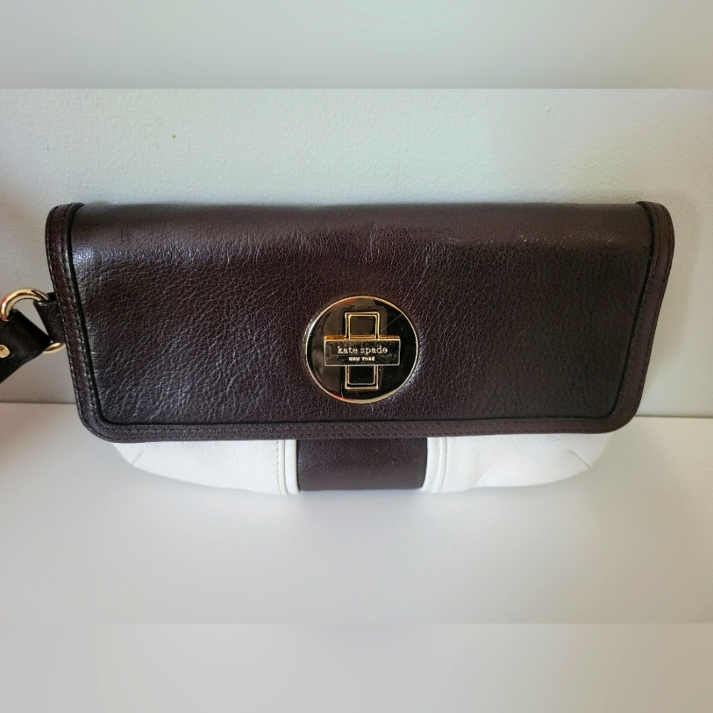 Kate spade cream and brown wristlet H-4.75. W-8.5.